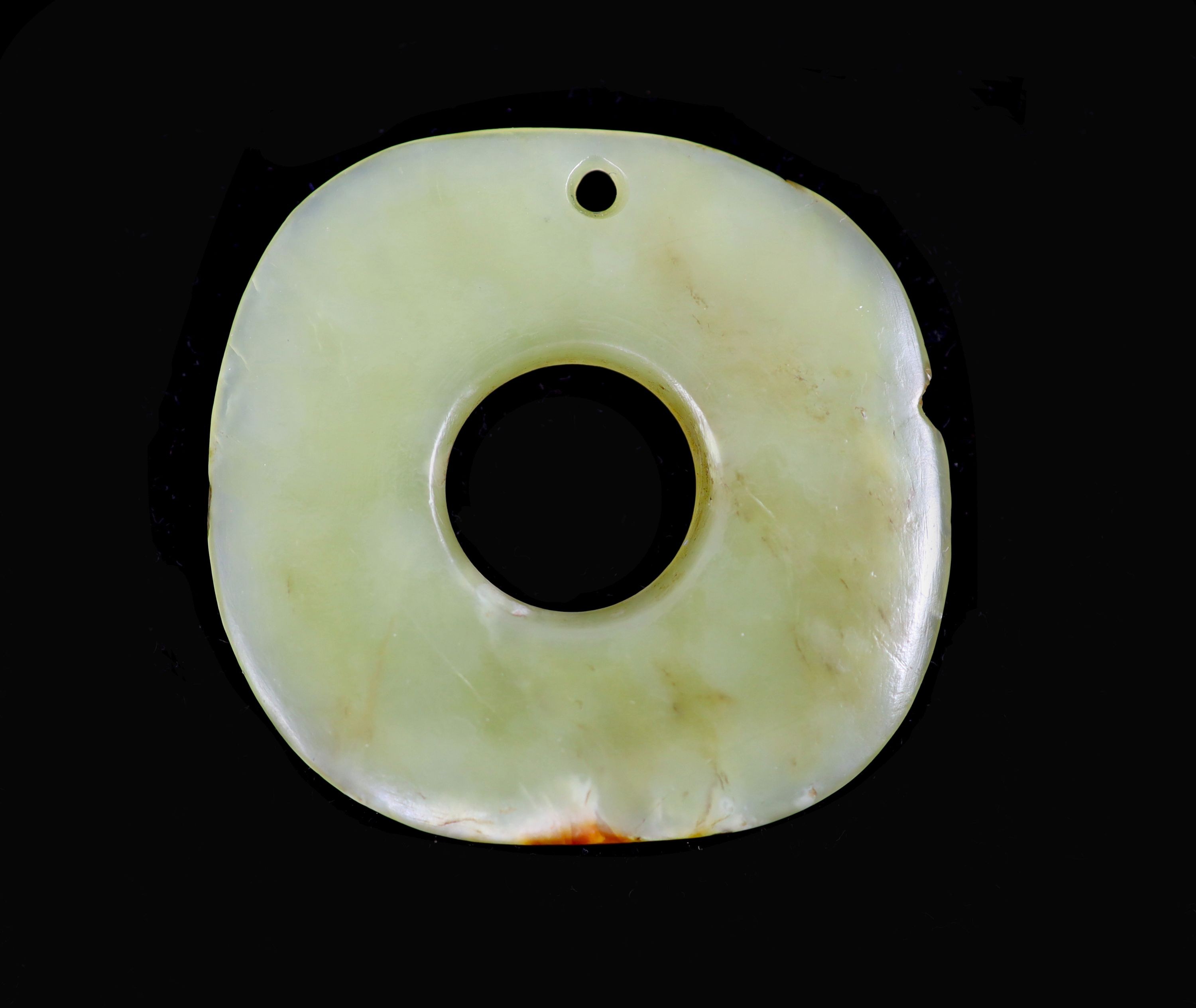 A Chinese yellow jade bi disc, possibly Hongshan Culture, 4.6 cm, nick to edge